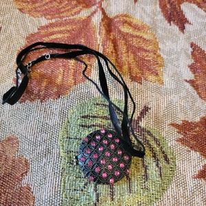 Necklace with hidden compartment